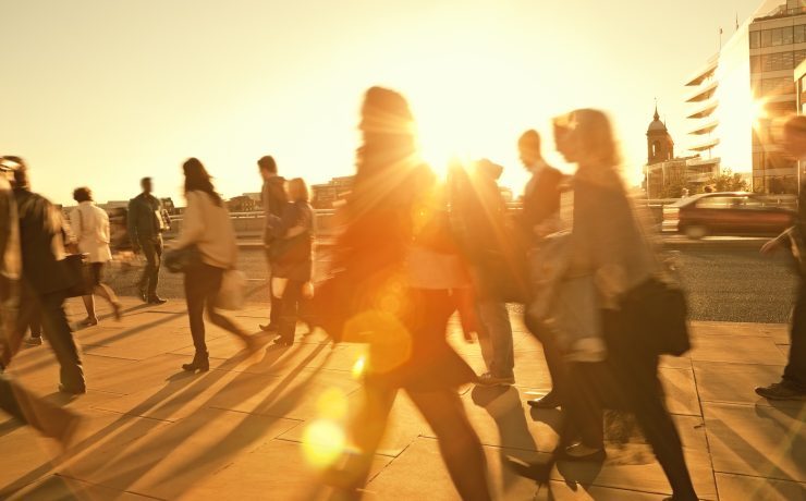 Business Commuters Walking Home After Work, Sunset Backlit, Blurred Motion
